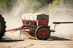 Seed drill being pulled by tractor
