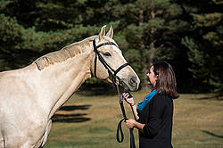 Woman with a palomino horse