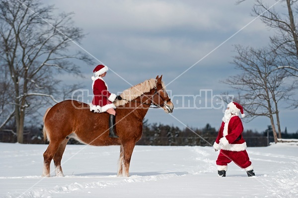 Santa Claus and Mrs. Claus horseback riding
