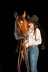 Portrait of a young woman and her American Quarter Horse gelding