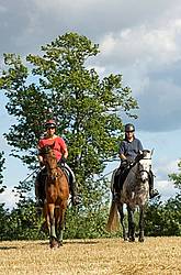 Two women horseback riding