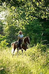 Woman riding Spotted Saddle Horse