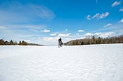 Woman riding Hanoverian mare in deep snow