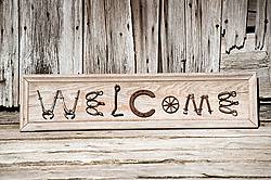 Hand crafted Welcome art sign made out of wood and recycled or repurposed farm tools and machinery parts