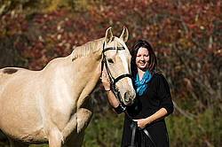 Woman with a palomino horse